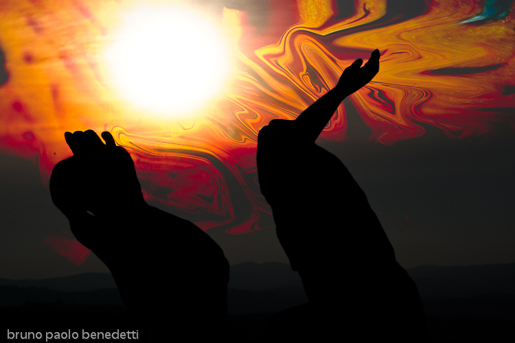 apocalypse burning sky with two hands on foreground