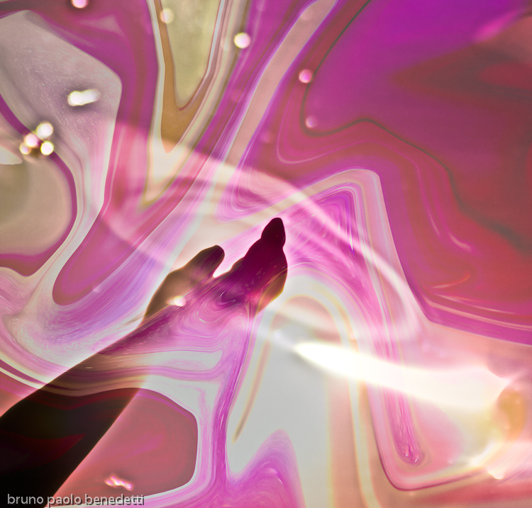 surreal emerging hand from water and colored fluid pink and red background