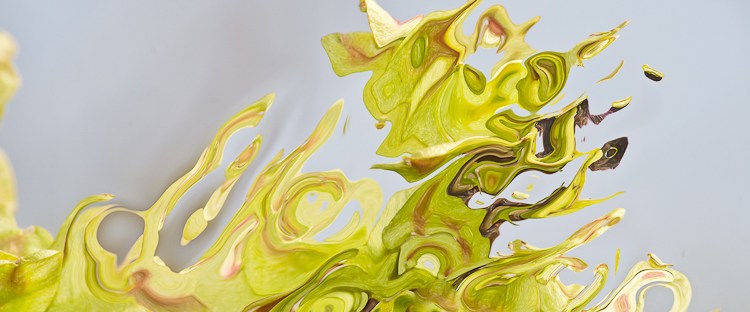 fluid green shape with shades dissolving into pieces