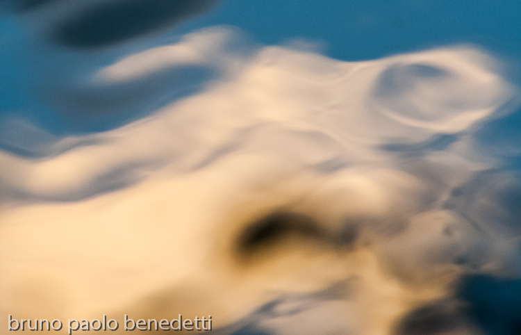 abstract floating shapes with yellow shades on blue