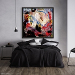 canvas print with abstract dynamic pattern in red, white and black dominant colors on a bedroom wall